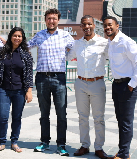 Pre-seed founder and managing partner investor Sergio Paluch standing and smiling with buildings in the background